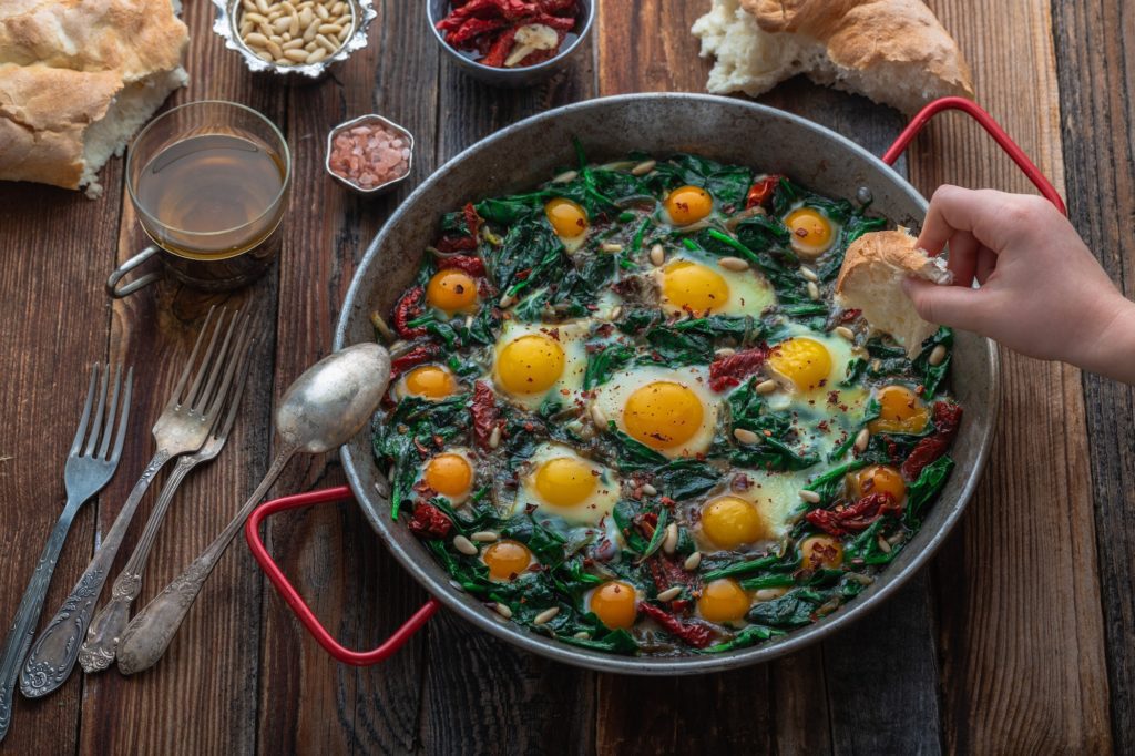 Why You Need To Use Zoom In Your Business 1 Hand dipping bread in an egg yolk