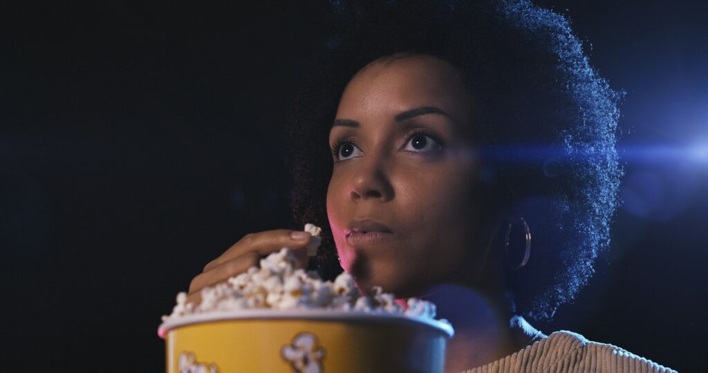 Woman watching a movie at the cinema